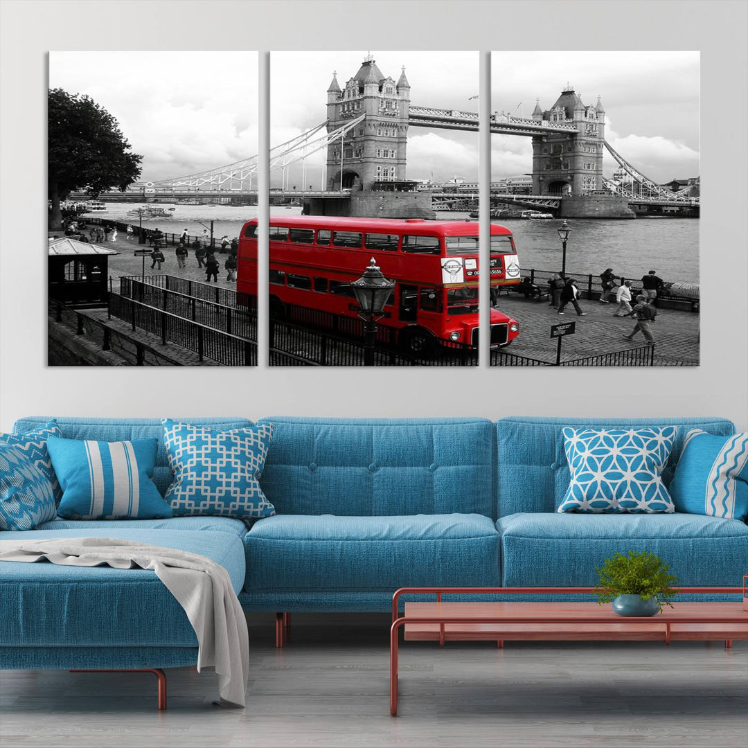 The London Red Bus and Bridge Wall Art Canvas Print showcases a red London bus in front of Tower Bridge, beautifully presented as a gallery-wrapped canvas. This striking image is divided into three panels, delivering a museum-quality display that's ready to hang.