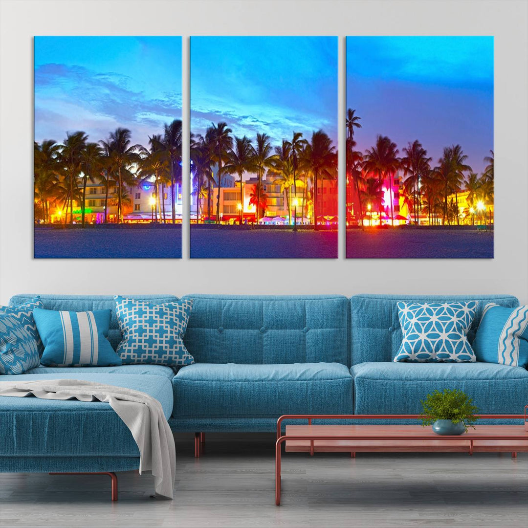 The living room features a three-panel Miami City Wall Art Canvas Print, showcasing a colorful, illuminated beach scene with palm trees on museum-quality canvas.