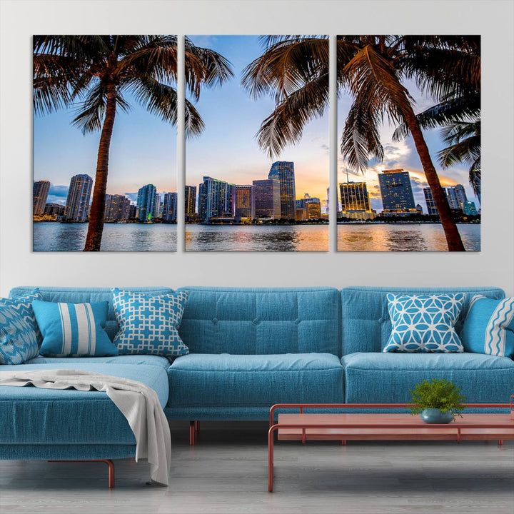 The Wall Art MIAMI Canvas Print features a triptych design depicting palm trees and a city skyline at sunset.