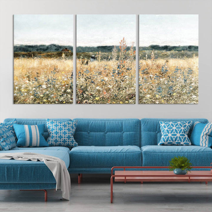 The "Wildflower Field Wall Art Canvas" brings rustic charm to the room with its nature-inspired landscape print, making it a perfect addition to the living room or office.