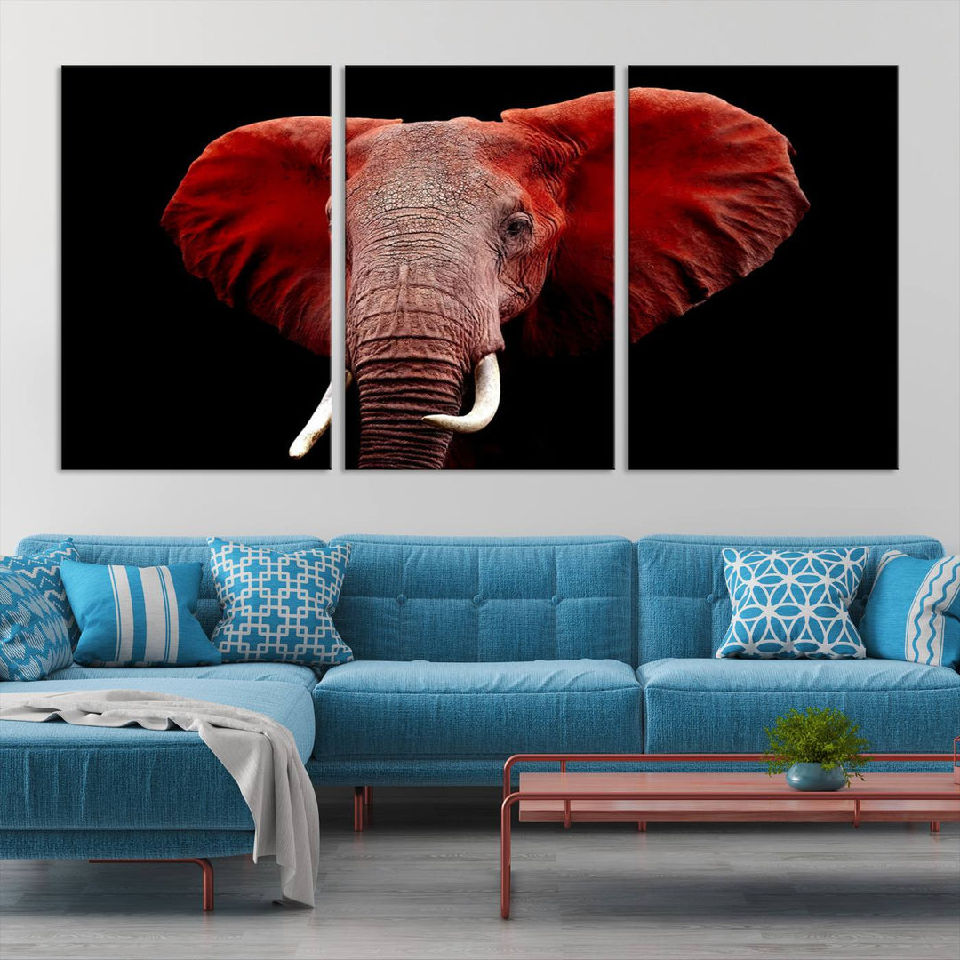 A Wall Art Canvas Print in the modern living room features a three-panel premium design of a red elephant face.