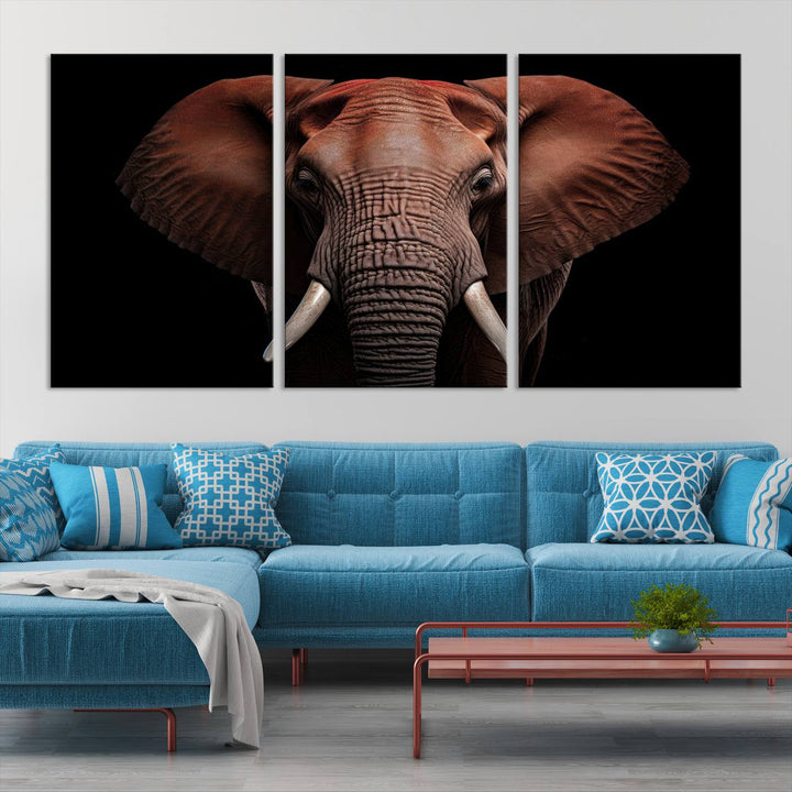 A stunning triptych titled "Wild Elephant Wall Art Canvas Print" beautifully enhances the wall above a contemporary living room. This Africa Savannah Wild Animal Wall Decor Print is of museum-quality, complete with a UV-protective coating to ensure its vibrancy and beauty are preserved for years.