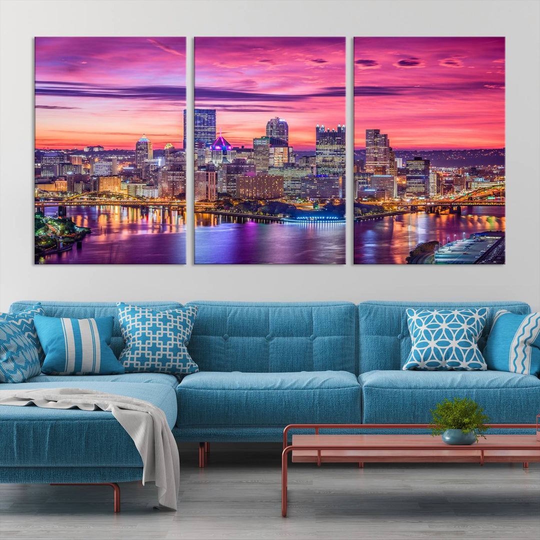 The Pittsburg Wall Art Canvas Print, showcasing a vibrant sunset glow over the city skyline and crafted by a professional artisan, adorns the space.