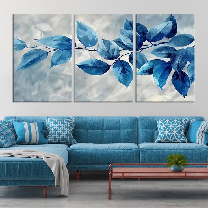 A Blue Leaf Abstract Wall Art Canvas Print, featuring a textured background and gallery-quality finish, is displayed.