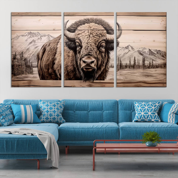 A stunning triptych artwork from the "Bison Canvas Wall Art American Buffalo Print Rustic Decor for Farmhouse Wall Art" collection graces the modern living room. Its vibrant colors are enhanced by museum-quality canvas and a UV-protective coating. The gallery-wrapped piece adds elegance to the space.