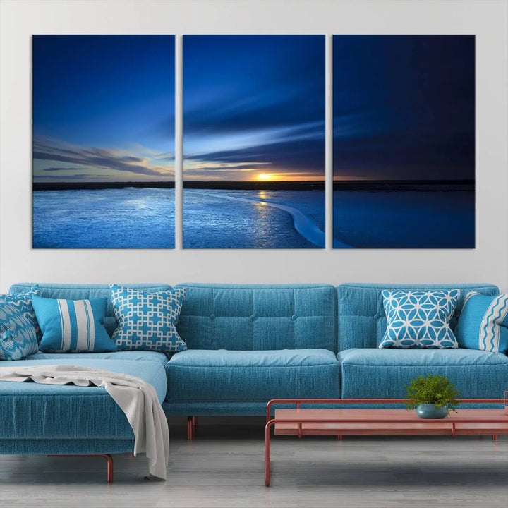 The living room features a triptych of the Wall Art Canvas Print Navy Sunset Lake Landscape Artwork, adding to its tranquil vibe.