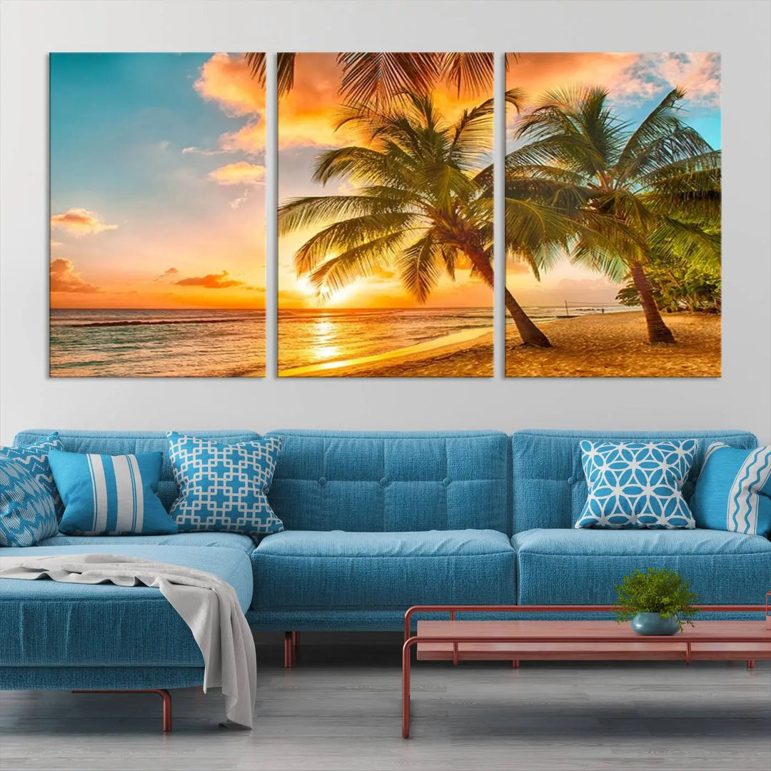 The Tropical Sunset Wall Art Print features a vibrant beach scene with palm trees and an ocean view highlighted by a golden sunset.