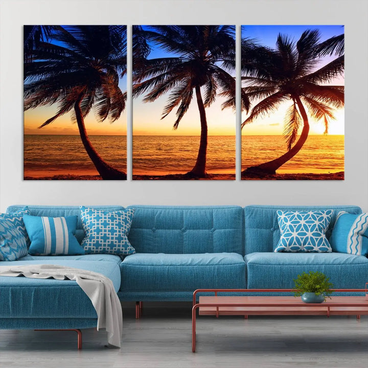 The living room features a wall adorned with the "Wall Art Canvas Curve Palms at Sunset on Beach," showcasing gallery-wrapped, museum-quality canvases in a stunning triptych.