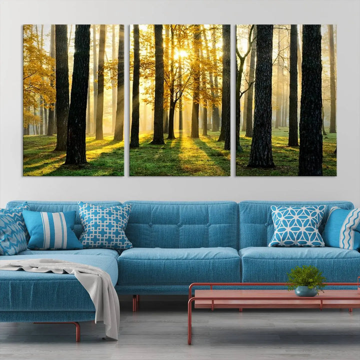 The living room is enhanced by the "Wall Art Landscape Canvas Print Tall Trees in Forest at Sunset" on museum-quality canvas. This triptych, complete with a UV-protective coating, is ready to hang and adds an artistic touch to the space.