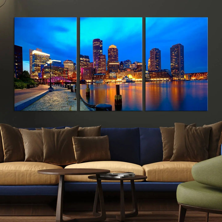 A triptych of the "Boston City Lights Night Blue Skyline Cityscape View Wall Art Canvas Print" adorns the wall. This museum-quality canvas artwork is ready to hang and includes a UV-protective coating for lasting brilliance.