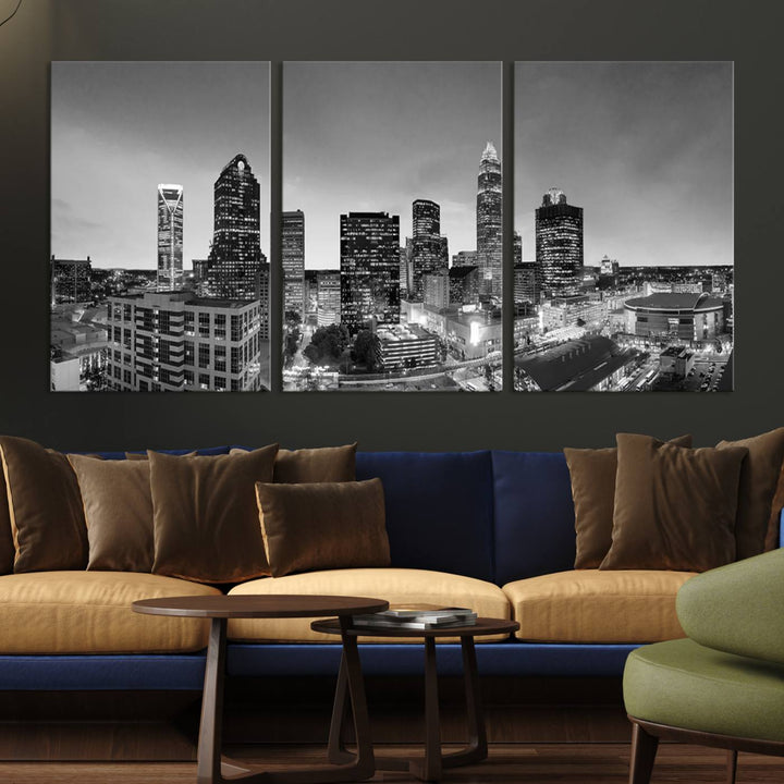 The "Charlotte City Cloudy Skyline Black and White Wall Art Cityscape Canvas Print" hangs on a dark wall, showcasing its UV-protective properties for enduring beauty.