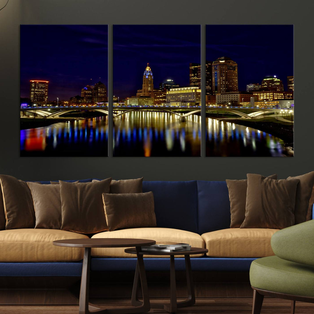 The "Columbus City Lights Night Skyline Cityscape View Wall Art Canvas Print" showcases a stunning city skyline at night, with illuminated buildings and bridges reflecting in the river, on a museum-quality canvas ready to hang.