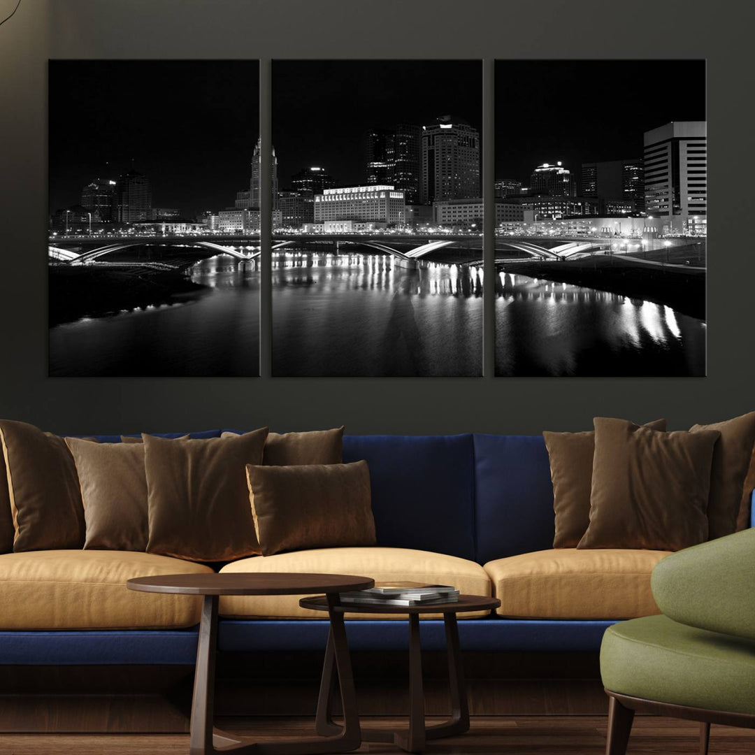 The living room features the "Columbus City Lights Skyline Black and White Wall Art Cityscape Canvas Print" above a coffee table. This artwork is presented as a triptych on museum-quality canvases with UV-protective coating.