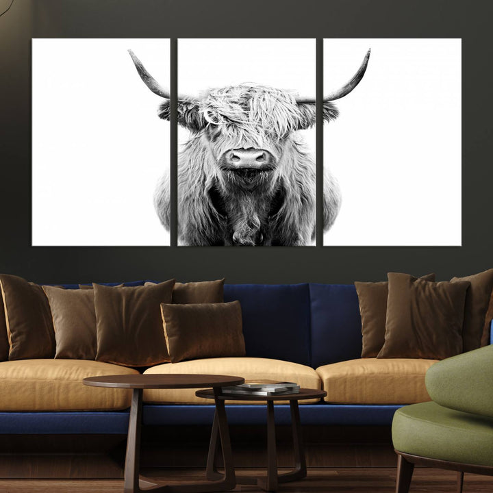 The wall art features a triptych of a Scottish Highland cow, printed on museum-quality canvases with a UV-protective coating. This decorative piece is known as the Highland Cow Canvas Wall Art Farm House Wall Art.