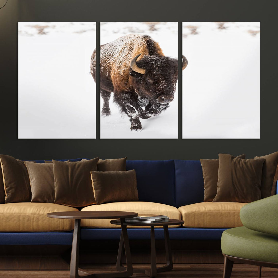 The Bison Winter Wall Art Canvas Print for Farmhouse Decor is displayed as a triptych in the living room. This artwork, printed on museum-quality canvases with a UV-protective coating to maintain its vibrant colors, is the focal point of the space.