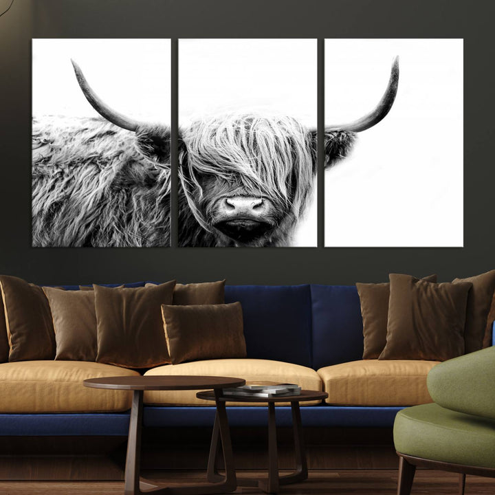 A museum-quality triptych titled "Black White Scottish Highland Cow Cattle Art Print Farmhouse Wall Art Canvas Print" embellishes the dark wall. The canvas is equipped with a UV-protective coating to ensure lasting vibrancy.