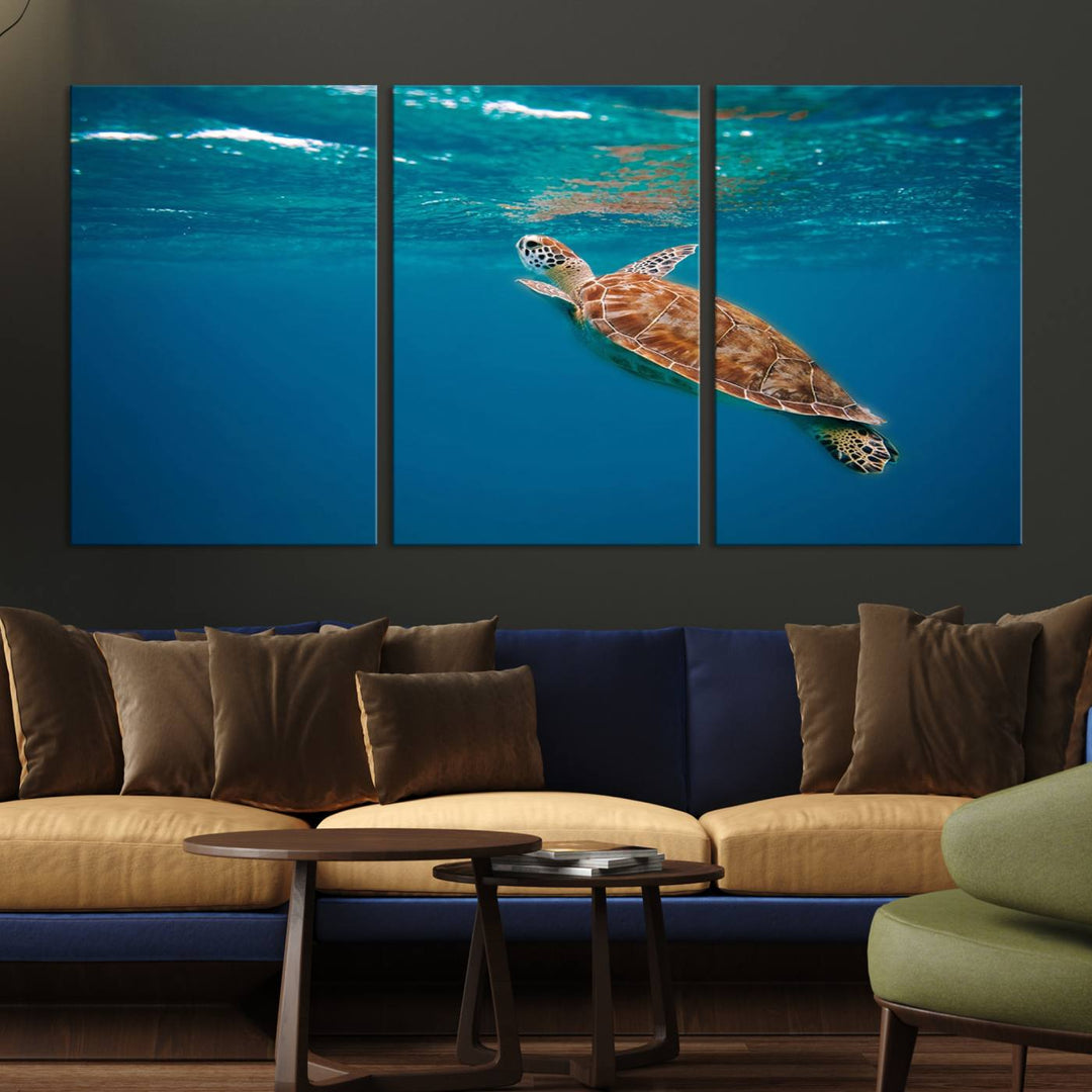 The living room features the "Baby Turtle in Ocean" wall art canvas print. This gallery-quality piece, depicting a sea turtle swimming underwater, adds an elegant touch to the space.