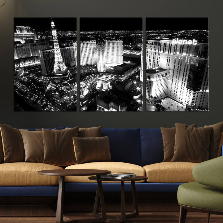 The Las Vegas Wall Art Canvas Print is a black and white triptych that showcases a city skyline at night. Crafted on museum-quality canvas with a UV-protective coating, it serves as an elegant and ready-to-hang focal point in the room.