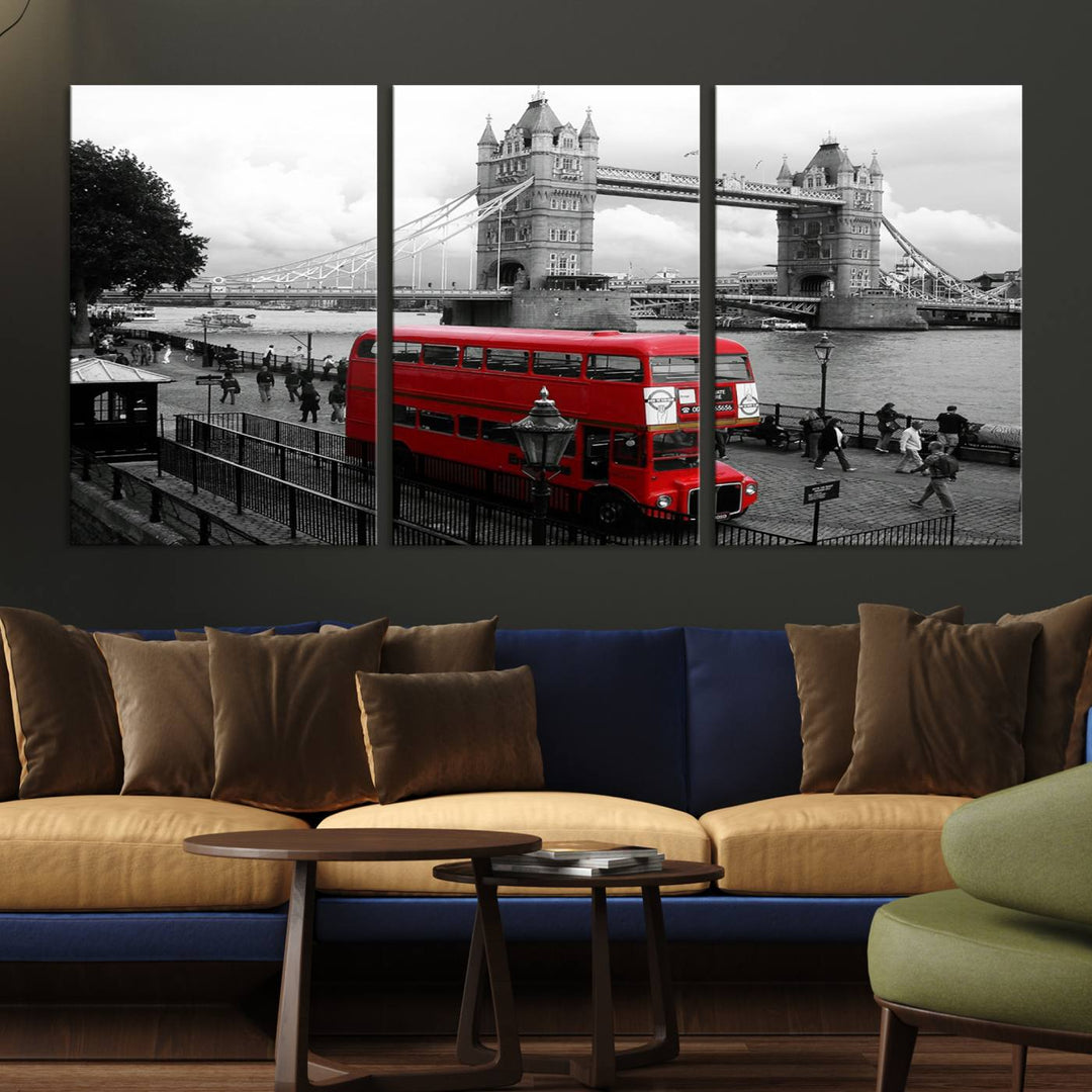 The London Red Bus and Bridge Wall Art Canvas Print showcases a red London bus in front of Tower Bridge, beautifully presented as a gallery-wrapped canvas. This striking image is divided into three panels, delivering a museum-quality display that's ready to hang.