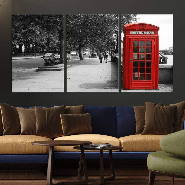 The London Phone Club Wall Art is a stunning piece that showcases a red telephone box set in a black and white street scene on museum-quality canvas. It is gallery wrapped with a UV-protective coating to preserve its vibrant charm.