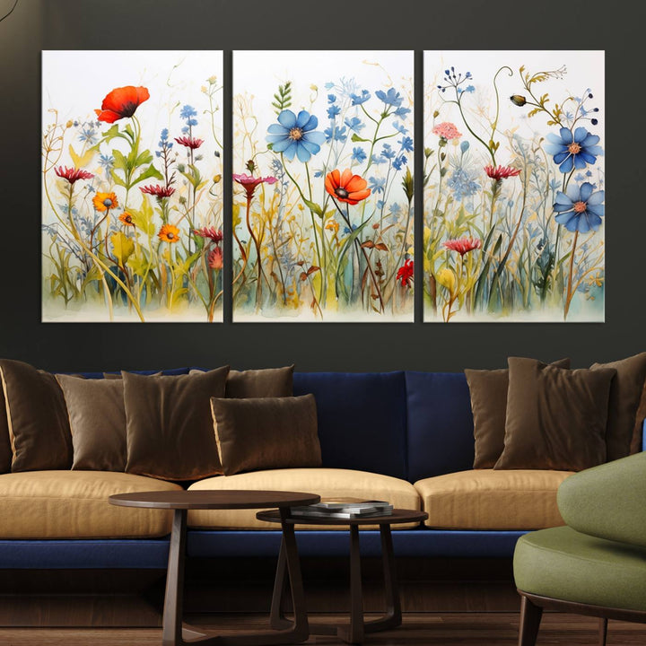 The Colorful Wildflower Canvas Wall Art – Vibrant Floral Botanical Print, consisting of a large 3 panel set, adds bright nature decor to the living room against a black wall.