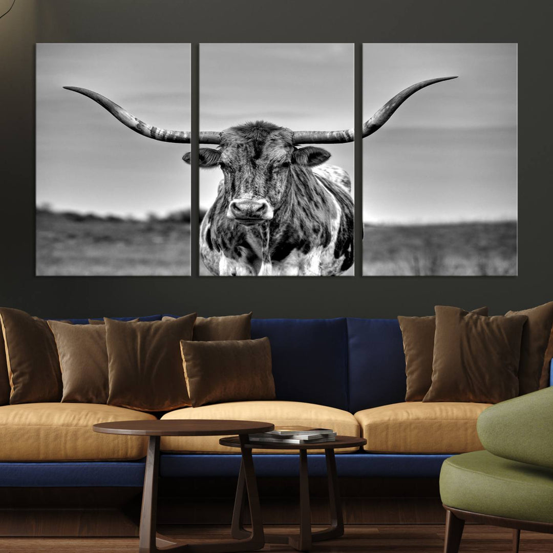 The Texas Longhorn Cow Wall Art, featuring a black and white image of a longhorn bull on canvas, brings charm to the room with its sophisticated appeal.