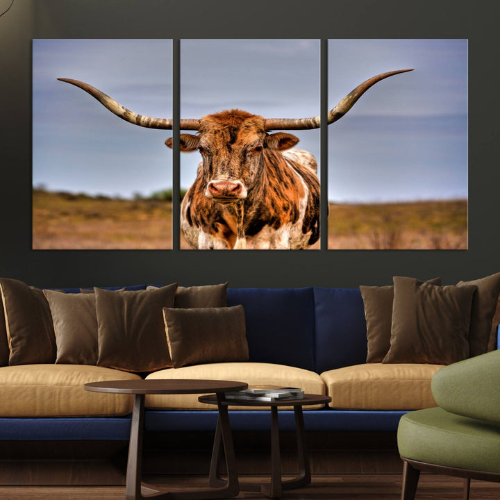 The Texas Longhorn Wall Art Print, a triptych canvas artwork depicting a longhorn bull in a field, features a gallery-quality finish.