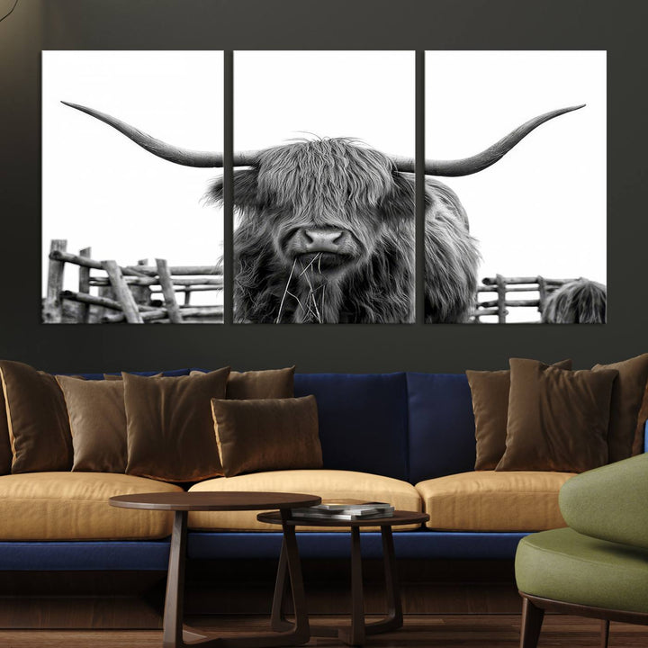 The Longhorn Canvas Print, featuring a black-and-white triptych of a Bighorn cow with shaggy fur and impressive long horns, is elegantly showcased. This wall art piece boasts a gallery-quality finish on premium canvas, bringing sophistication to any room.