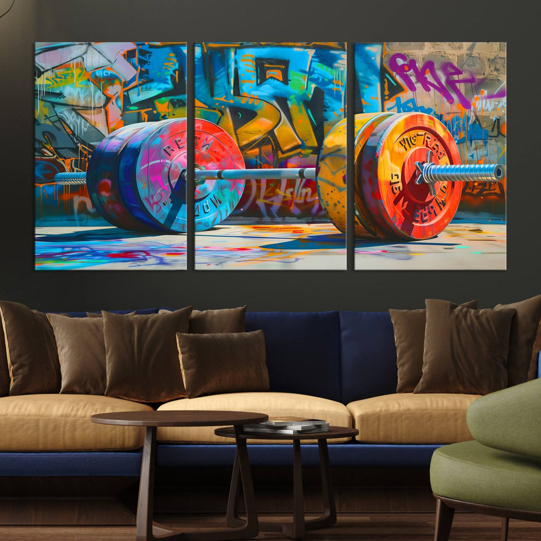 The Fitness Gym Barbell Graffiti Wall Art Canvas Print, a vibrant triptych featuring a barbell against a graffiti backdrop, elegantly hangs in the room. Crafted on premium canvas with a gallery-quality finish, this stunning piece of wall art effortlessly combines urban flair with sophisticated decor.