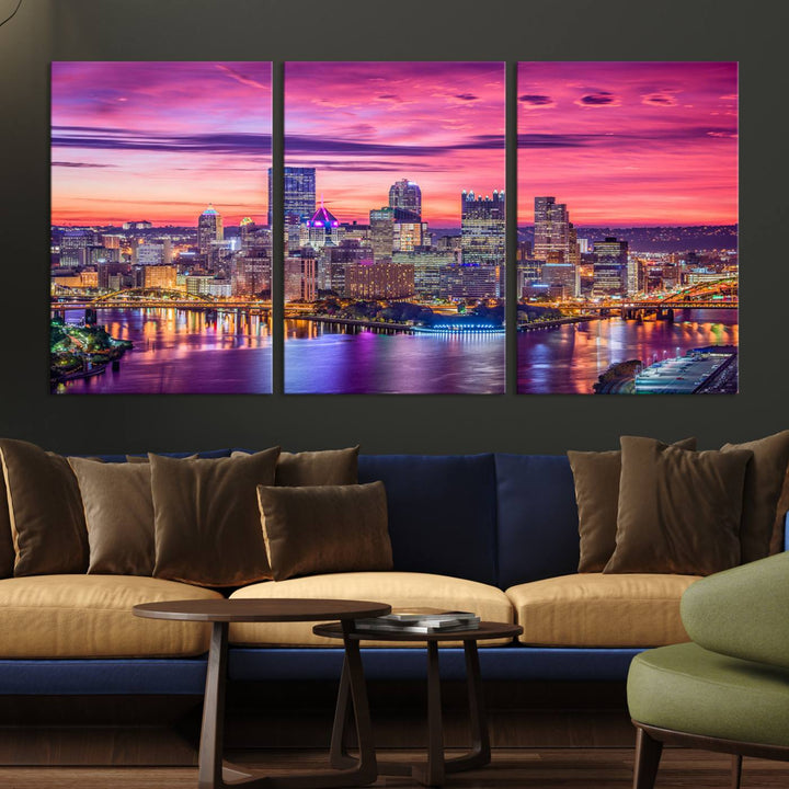 The Pittsburg Wall Art Canvas Print, showcasing a vibrant sunset glow over the city skyline and crafted by a professional artisan, adorns the space.