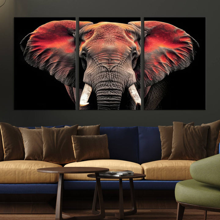 The Elephant Wall Art Canvas Print, featuring vibrant red and black tones, is a stunning artwork printed on museum-quality canvas. It comes with a UV-protective coating.