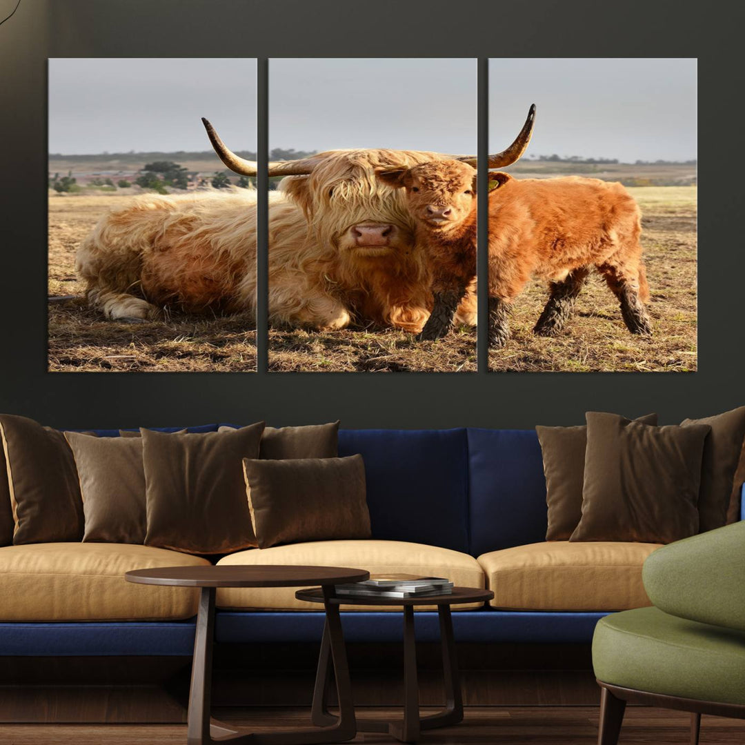 The three-panel canvas artwork, titled "Highland Cow Canvas Wall Art Animal Print for Farm House Decor," features a serene scene of a resting Highland cow and calf in a field. The piece highlights its gallery-quality finish.