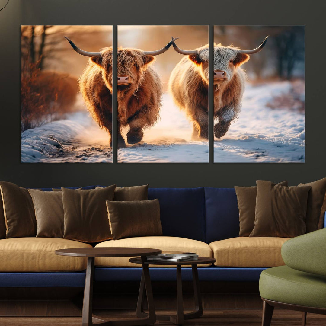 The living room showcases a triptych from the Scottish Highland Cow Horn Farm Wall Art Canvas Print collection, depicting two Highland cows running in the snow. Complementing this are handmade wall art pieces with a gallery-quality finish that add an elegant touch.