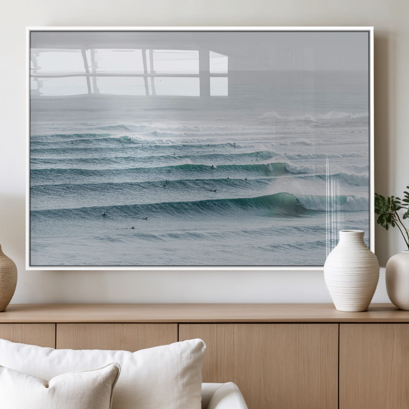 High-angle view of surfers lining up across layered ocean waves, ideal for minimal coastal or surf-inspired room decor.
