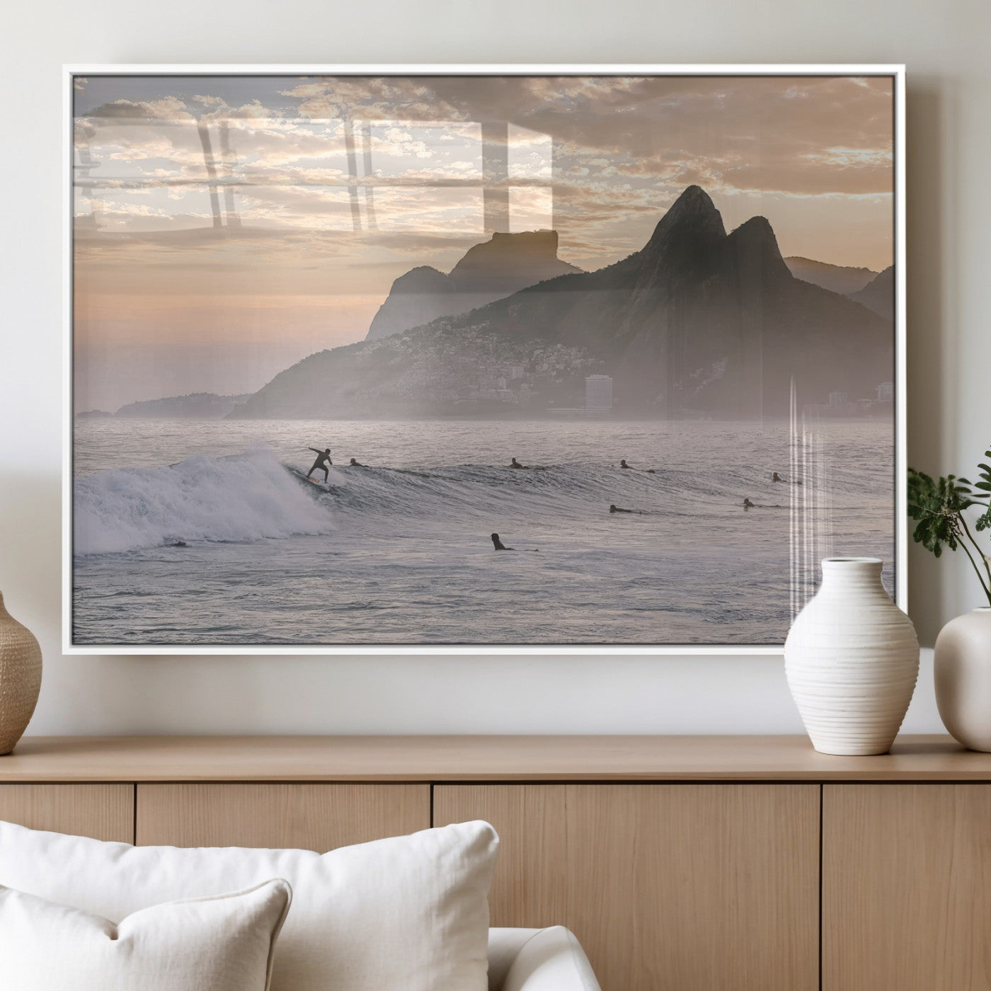 A surfer rides a golden hour wave near misty coastal mountains, surrounded by fellow surfers, capturing the spirit of a coastal adventure.
