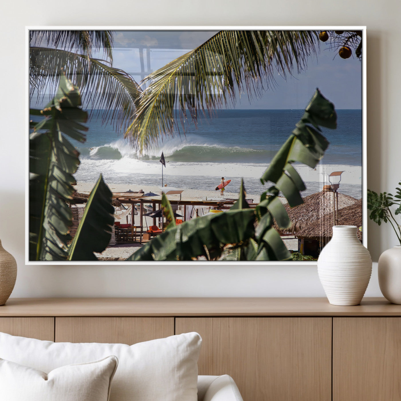 Canvas wall art of a tropical surf scene framed by palm trees, with a surfer on the shore and waves rolling in, ideal for beach-themed decor.