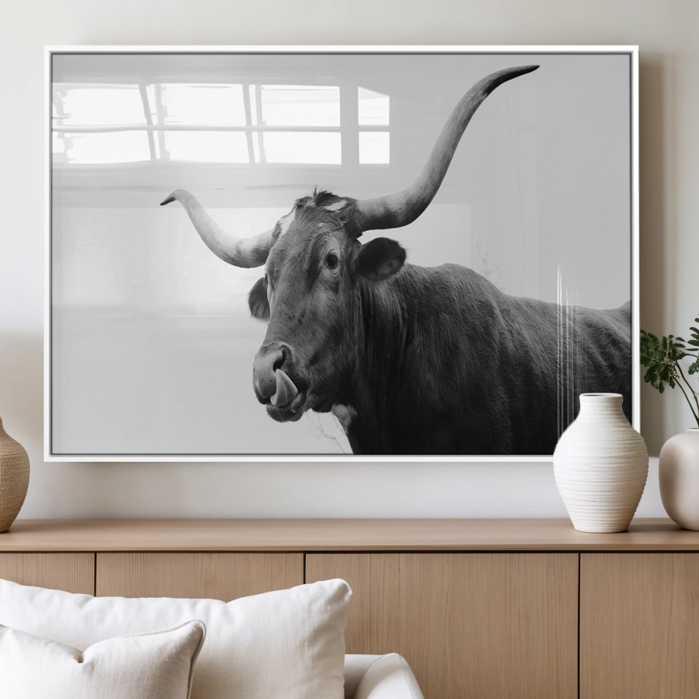 Black and white photo of a Texas Longhorn cow with curved horns, ideal for rustic, western or minimalist style home decor.