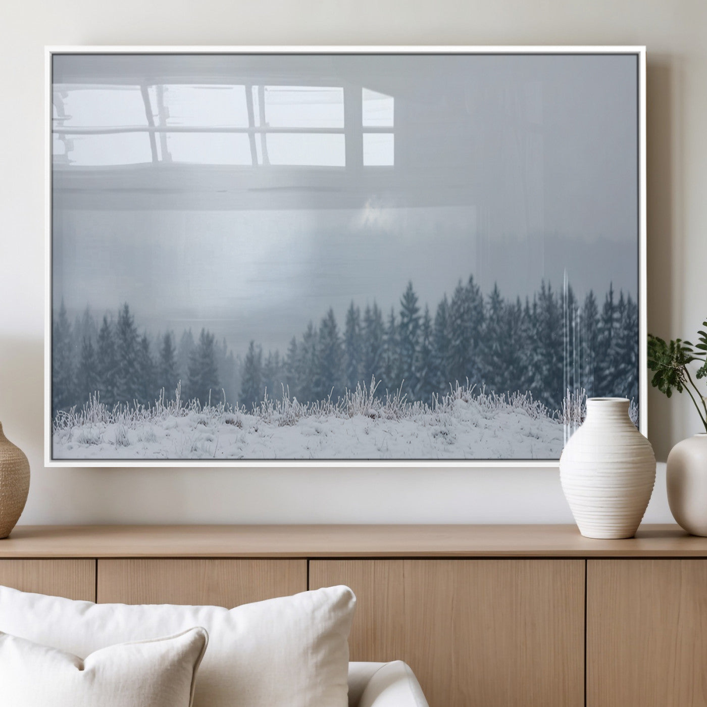 Snow-covered forest under misty sky, soft light breaking through clouds, ideal for minimalist or Nordic-inspired home decor.