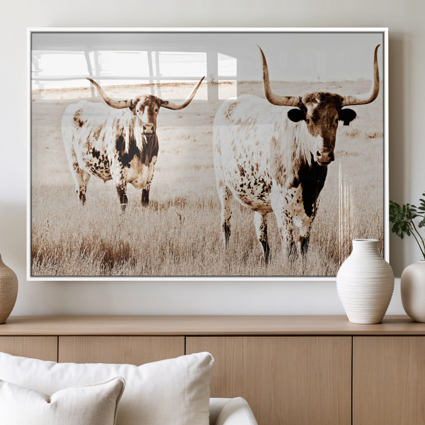 Two Texas longhorn cows standing in a sepia-toned pasture, evoking rustic charm perfect for farmhouse or western country interiors. (
