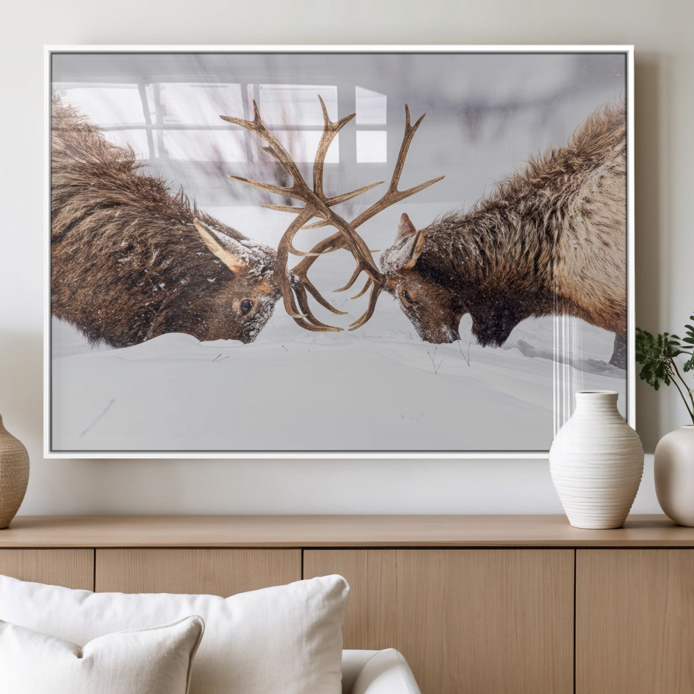 Two elk clashing antlers in a snowy forest, capturing raw power and wild energy, ideal for rustic cabin or lodge-style decor.