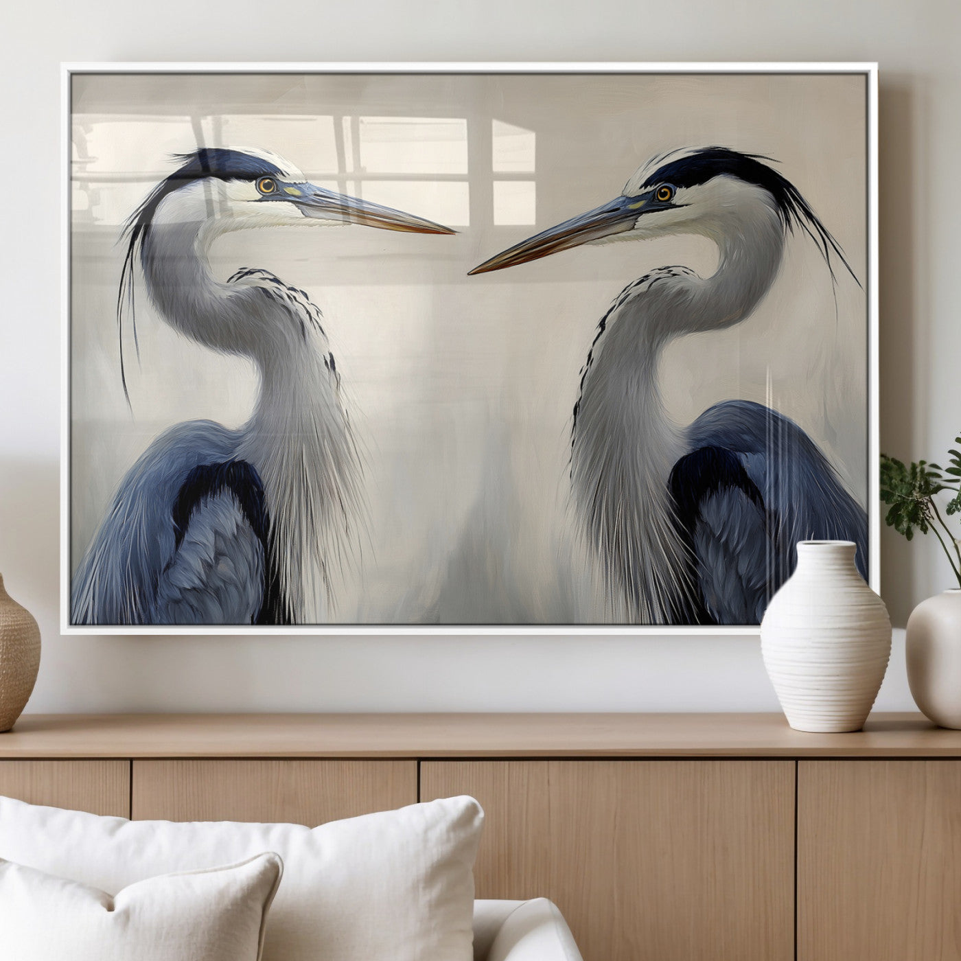 Two blue herons facing each other on a soft neutral background, ideal for coastal, tranquil, or nature-inspired minimalist interiors.