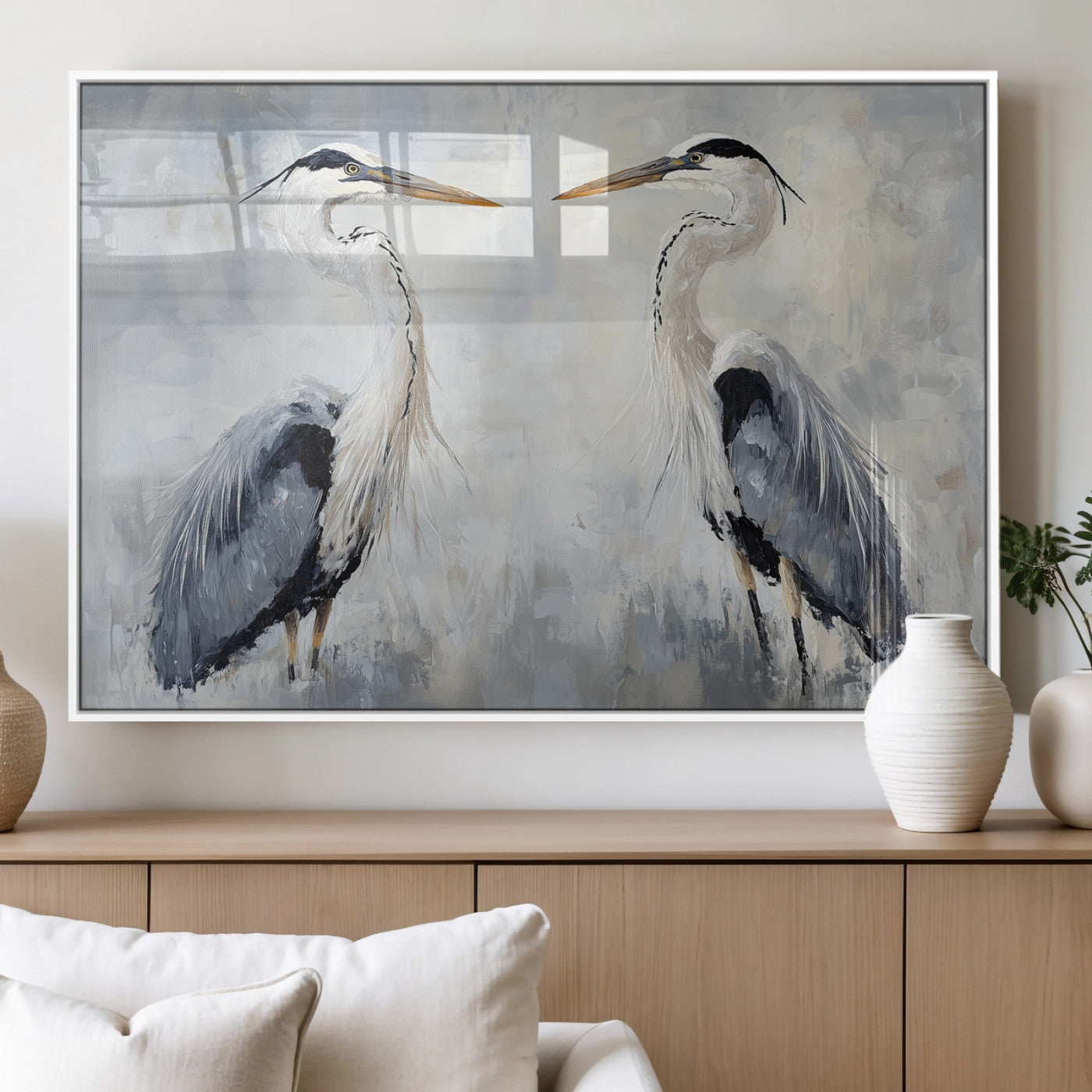 Two herons facing each other on a soft-toned background with blue-grey feathers, perfect for tranquil, coastal or nature-themed interiors.
