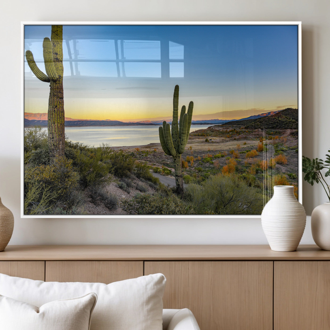 Desert landscape with saguaro cacti and lake at sunset, featuring vibrant sky and hills, ideal for Southwestern or rustic wall decor.