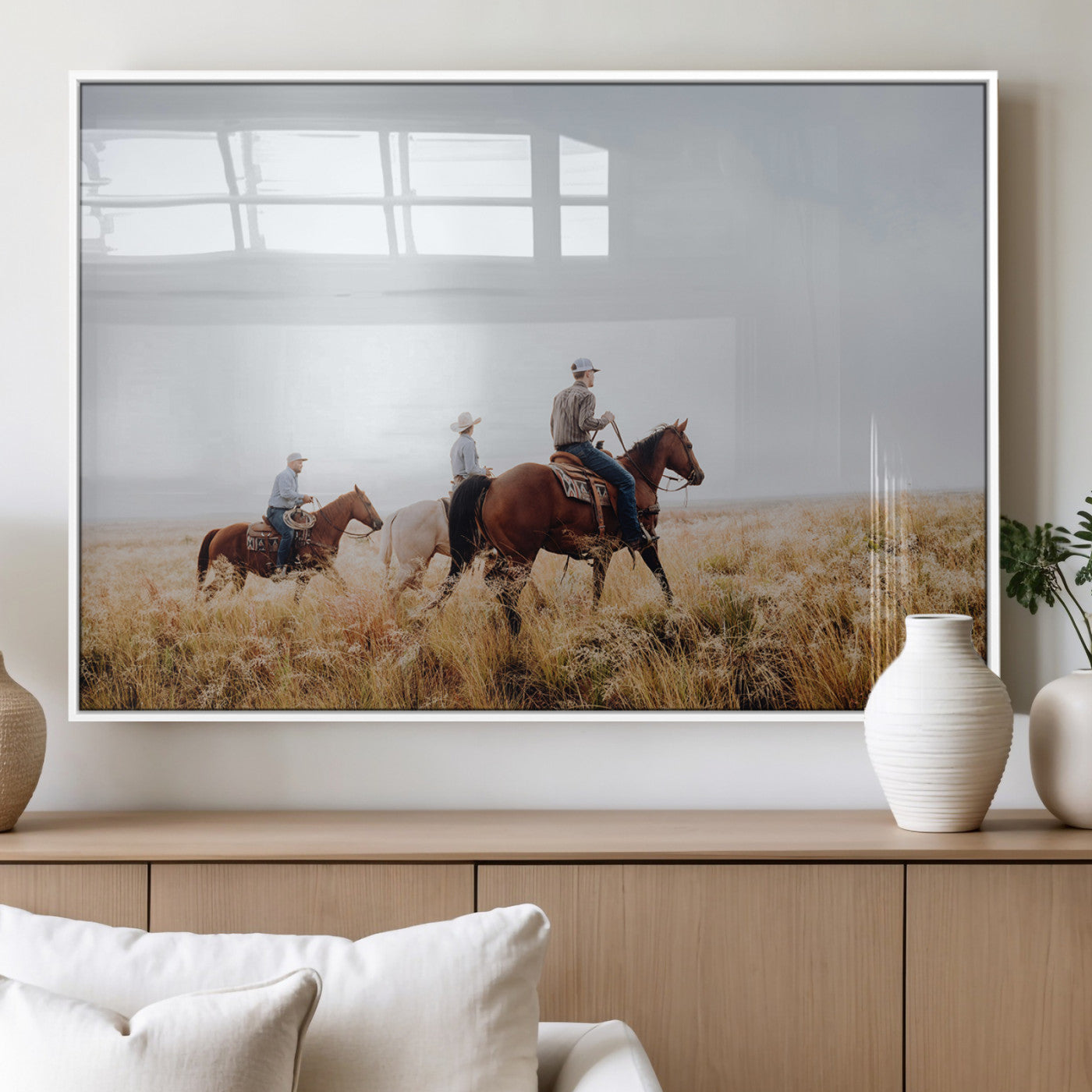 Three cowboys riding horses through a foggy prairie landscape, dressed in Western attire, evoking a rustic and adventurous Wild West aesthetic.