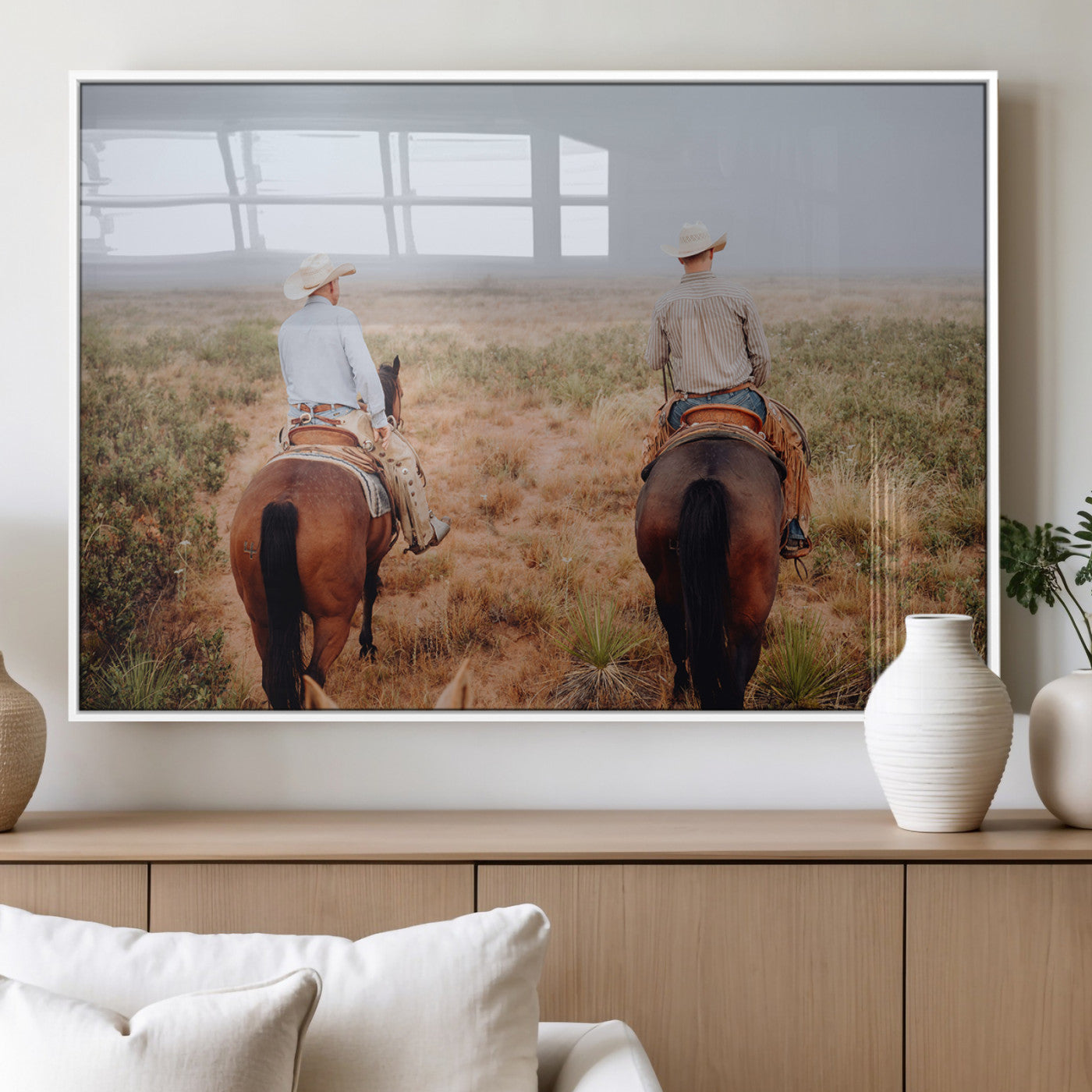 Two cowboys riding horseback through a misty prairie, capturing the rustic and adventurous spirit of the Western frontier.