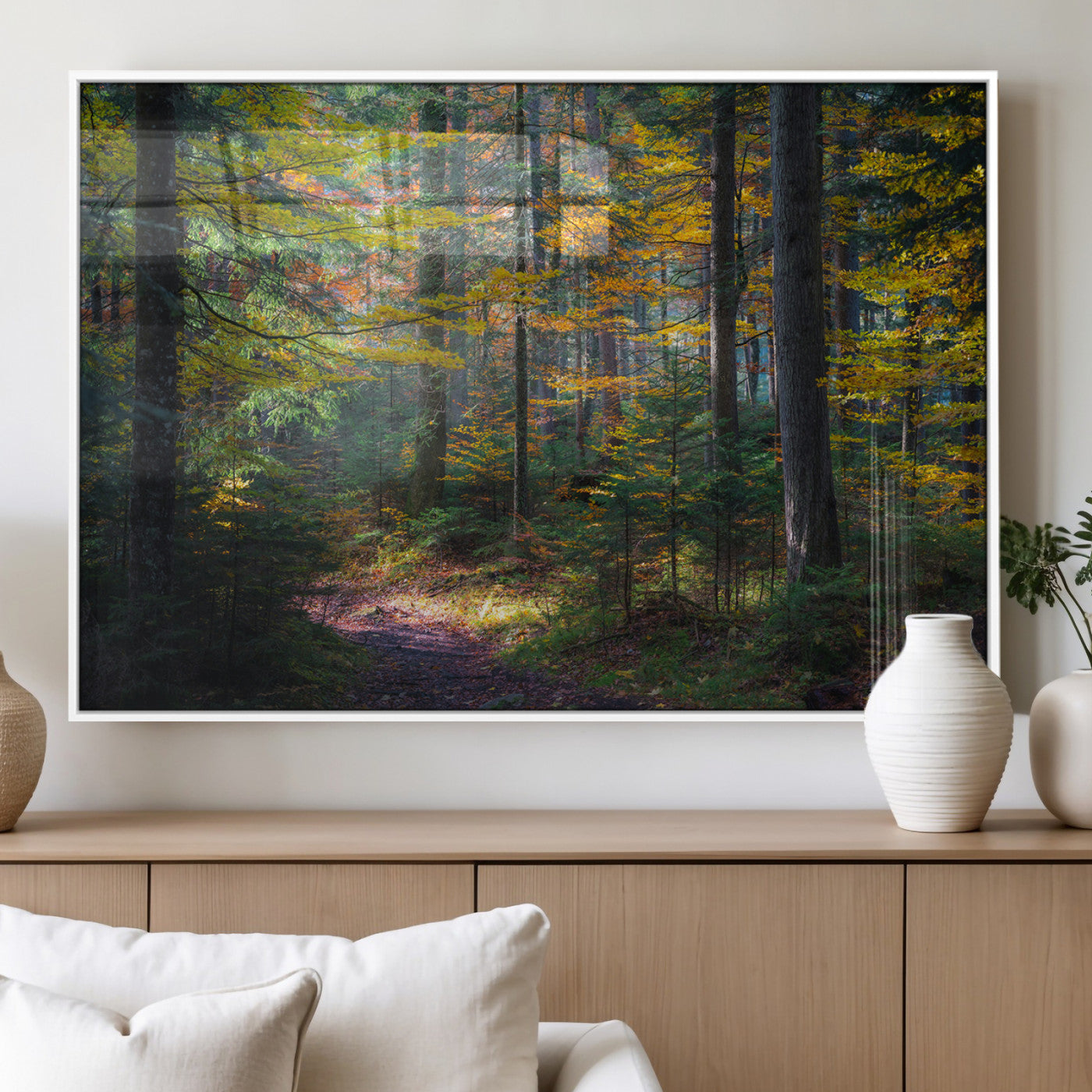 A serene autumn forest with golden and green leaves, a misty atmosphere, and a sunlit pathway, creating a tranquil nature-inspired wall art piece.