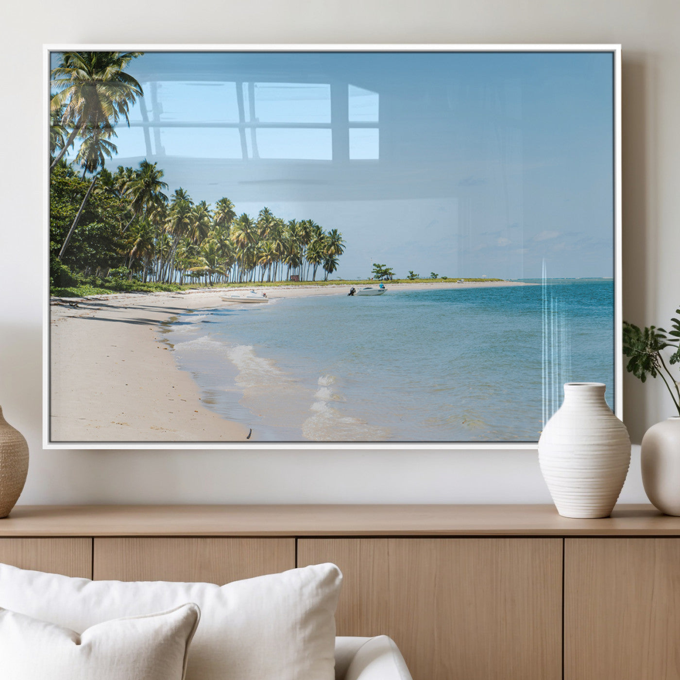 A serene tropical beach with clear blue water, soft sand, and lush palm trees under a bright sky, creating a peaceful island paradise atmosphere.