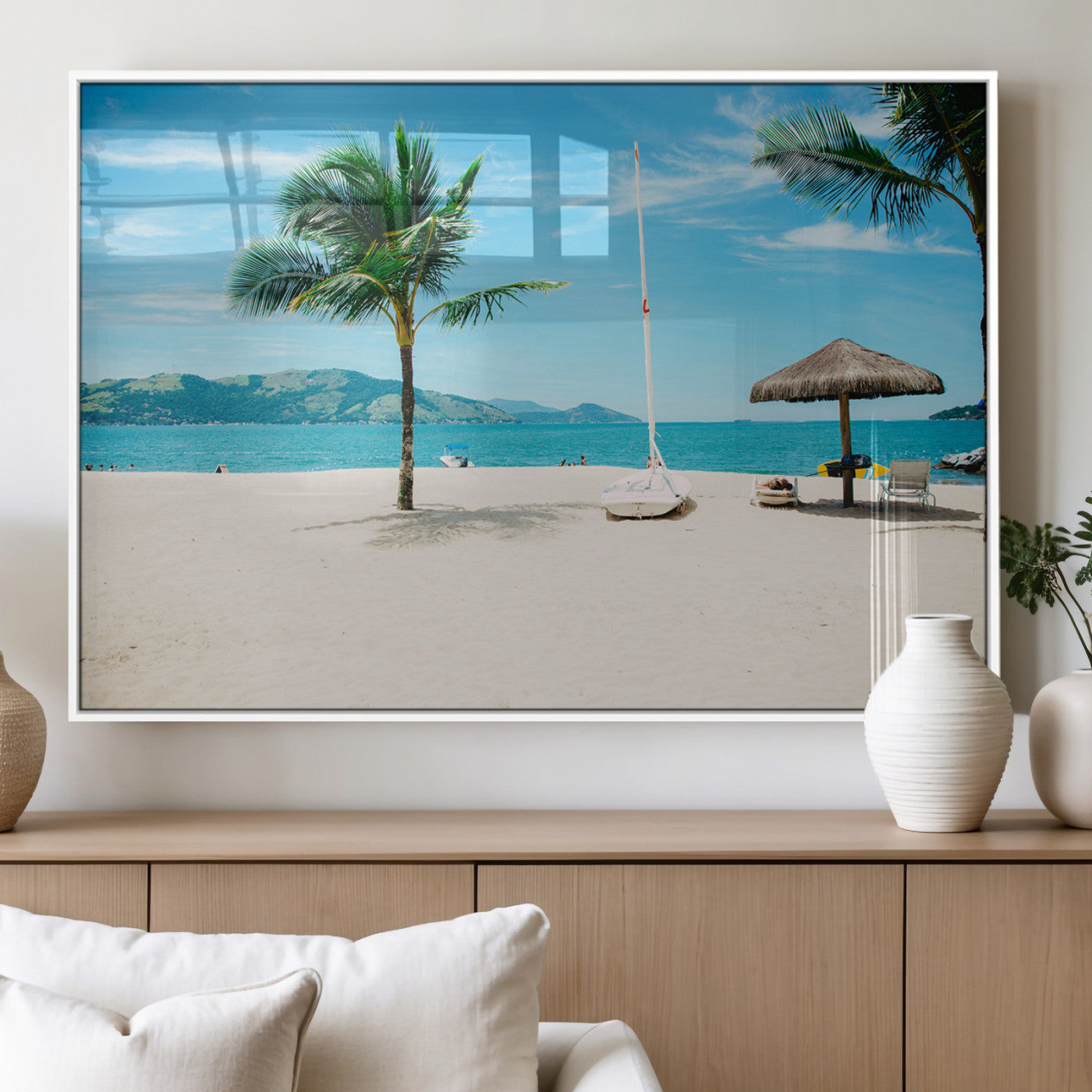 Tropical beach scene with palm trees, a white sailboat, and turquoise ocean waters under a bright blue sky, creating a peaceful summer vibe.