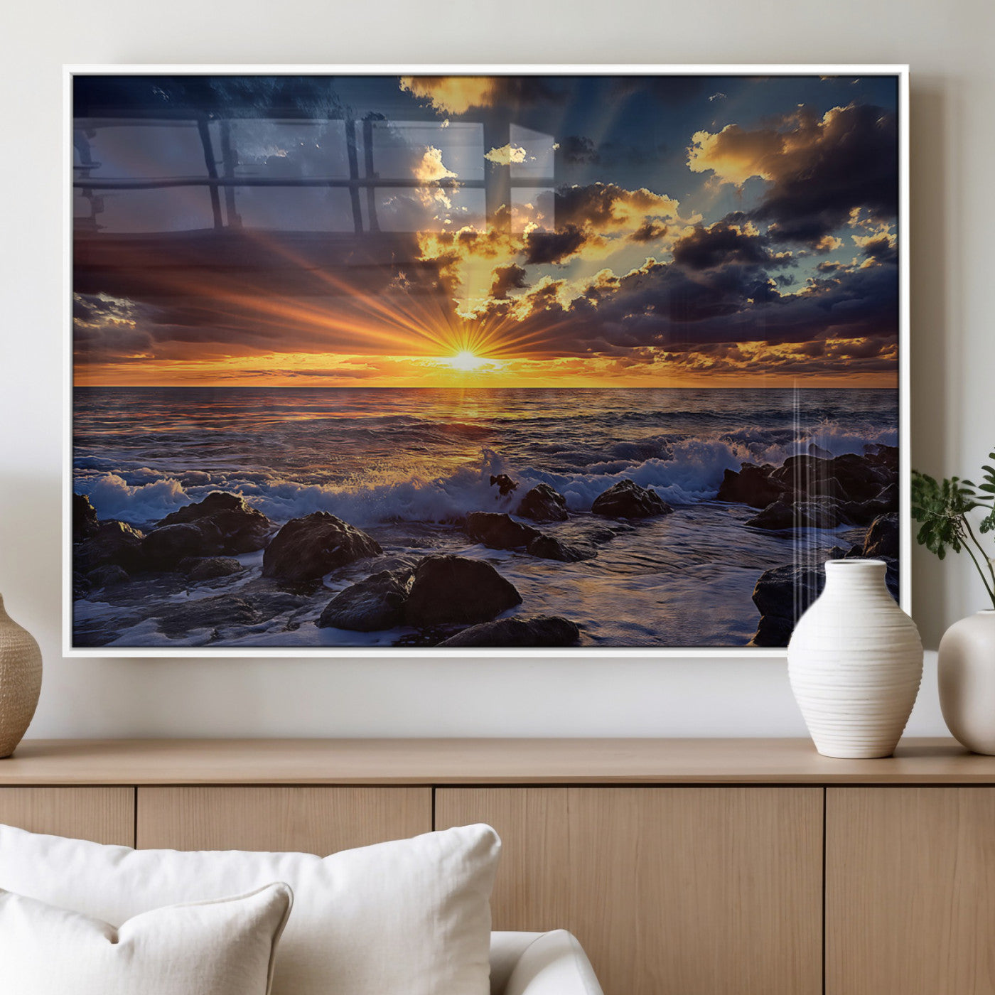 An explosive sunset over the ocean with dramatic clouds and rays of sunlight reflecting off the water, creating a vibrant and captivating view.