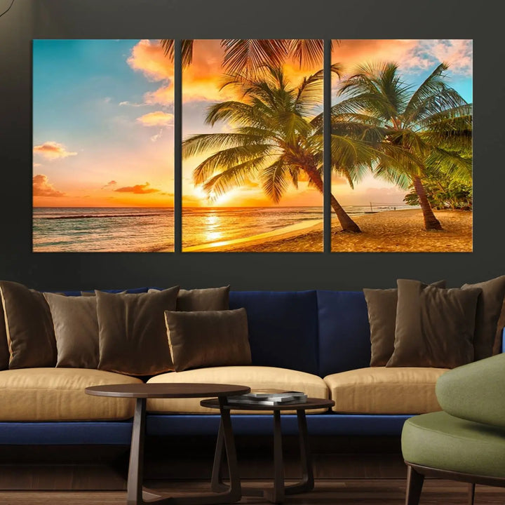 The Tropical Sunset Wall Art Print features a vibrant beach scene with palm trees and an ocean view highlighted by a golden sunset.